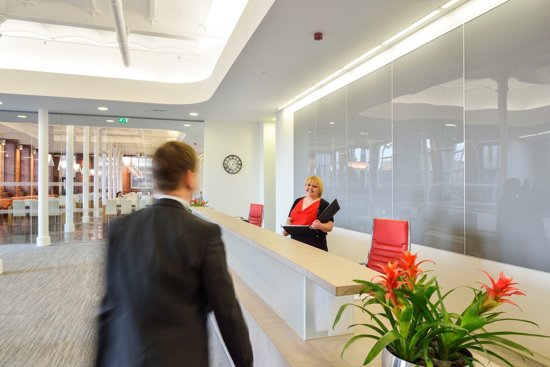 Man approaching the reception desk at Lowry Mill